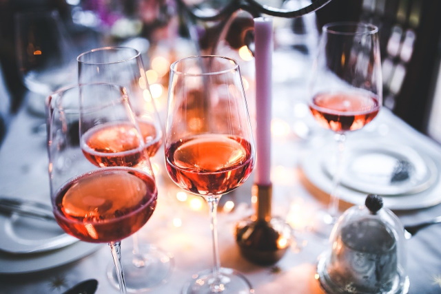 Four glasses of rose wine on a table
